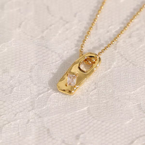 Hand Sculptured Elongated Gold with Diamond Zircon Pendant